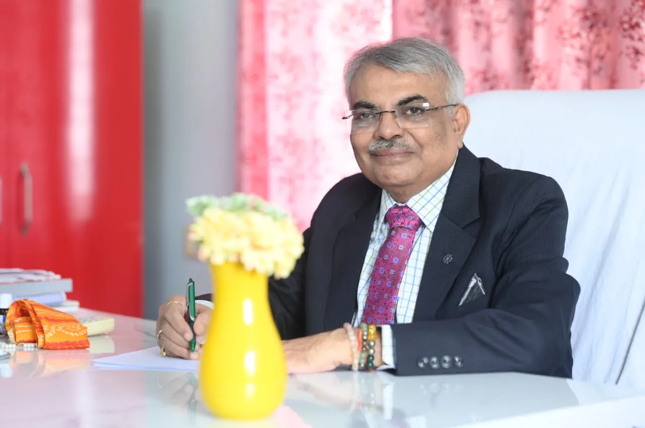 Abhishek Shrivastava writing at his desk